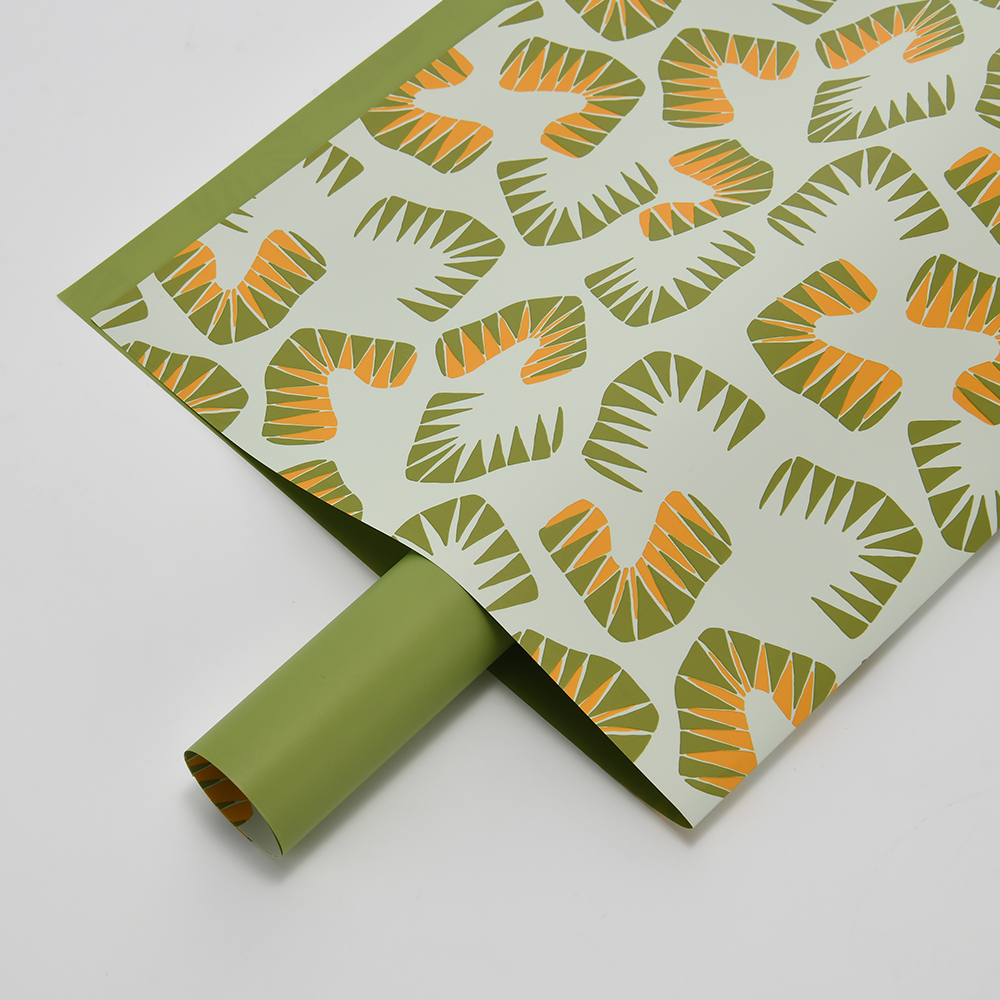 Zes felgekleurd bloemeninpakpapier met bladmotief