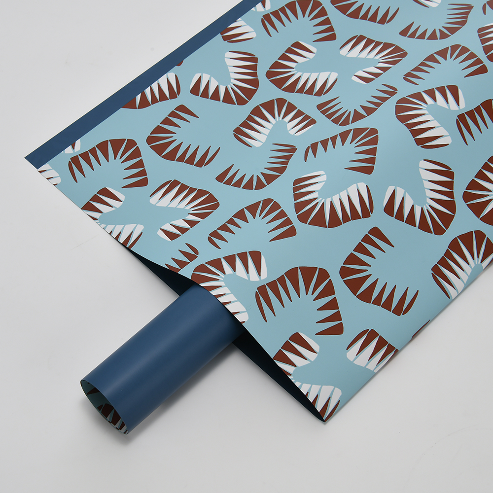 Zes felgekleurd bloemeninpakpapier met bladmotief