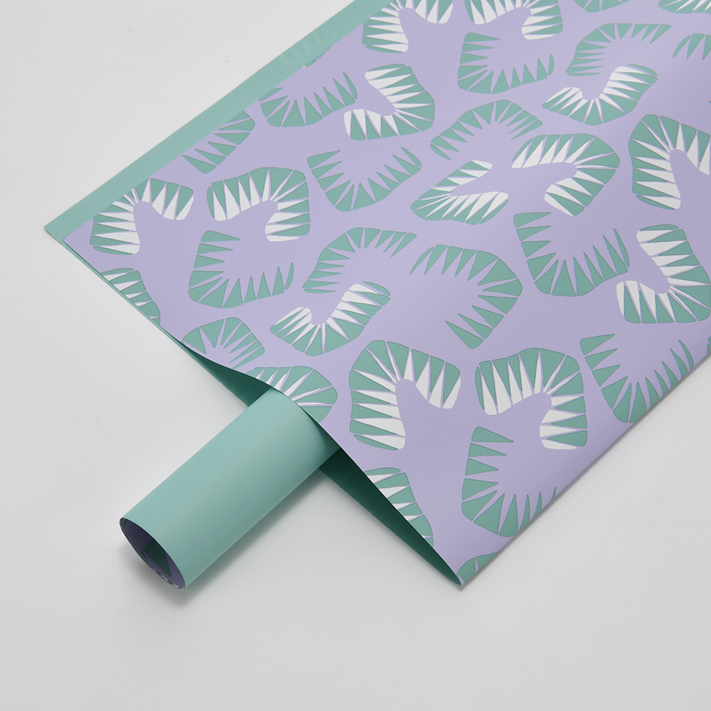 Zes felgekleurd bloemeninpakpapier met bladmotief
